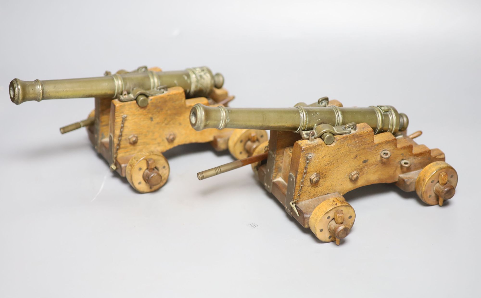 A pair of late 19th century bronze signal cannons, length 26cm